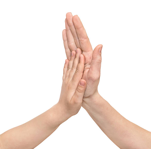 istock Child's hand on mother hand isolated on white 523619620