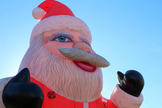 istock Head of a backlit inflatable Santa Claus 523619713