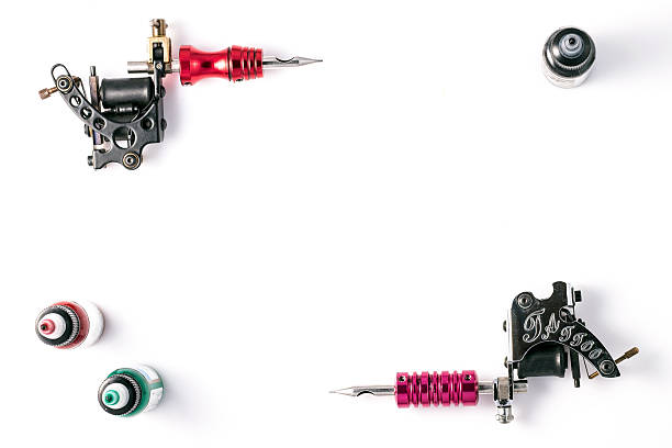 istock Tattoo machines and ink bottles  isolated on white background. 523620440