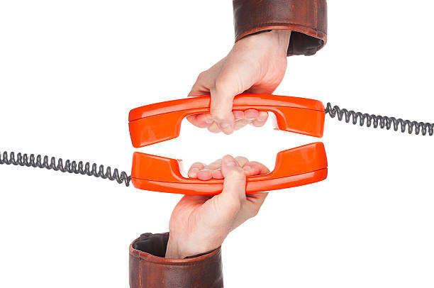 istock Two hands with old phones tubes on white background 523622006