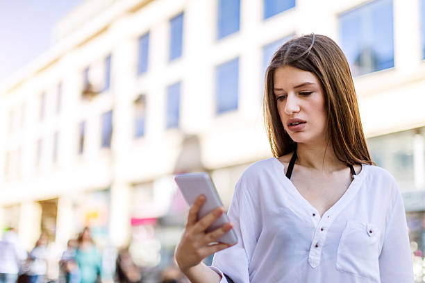 istock beautiful girl using smartphone 523622606