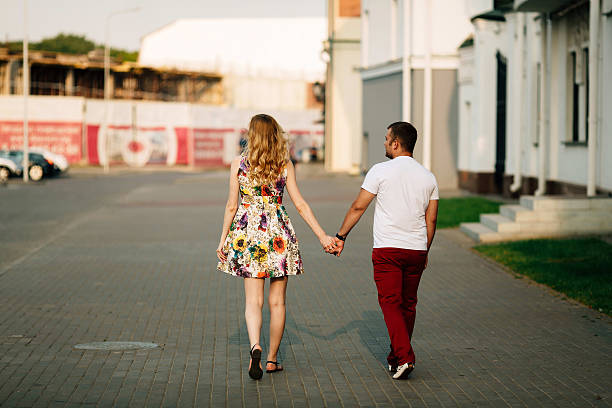istock Cheerful couple walking through the city together 523622888
