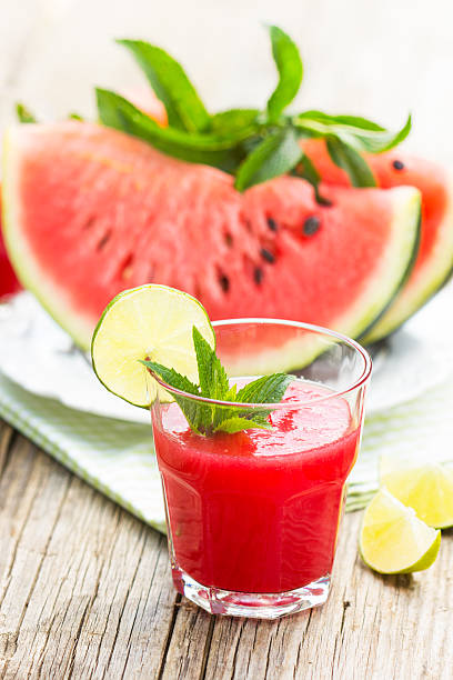 istock Watermelon juice with lime and mint in the glass 523623406