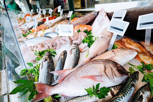 Fresh seafood on ice at the fish market stock photo