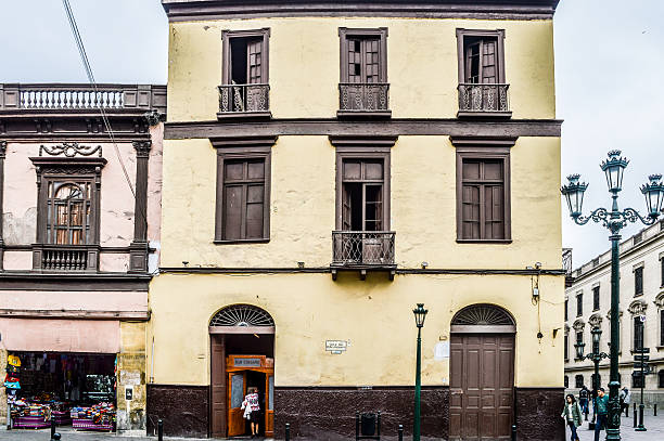 Lima, Peru - September 5, 2014: Typical street in the historical centre of Lima. People can be seen walking around.