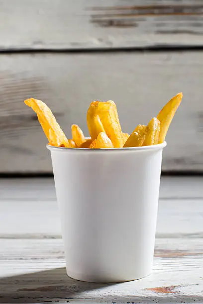 Photo of Cup with french fries.