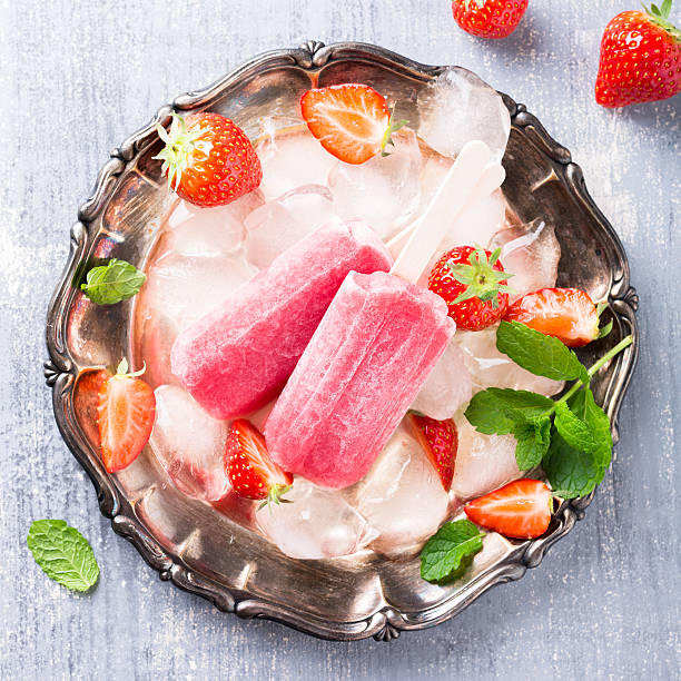 istock Homemade strawberry popsicles 523627784