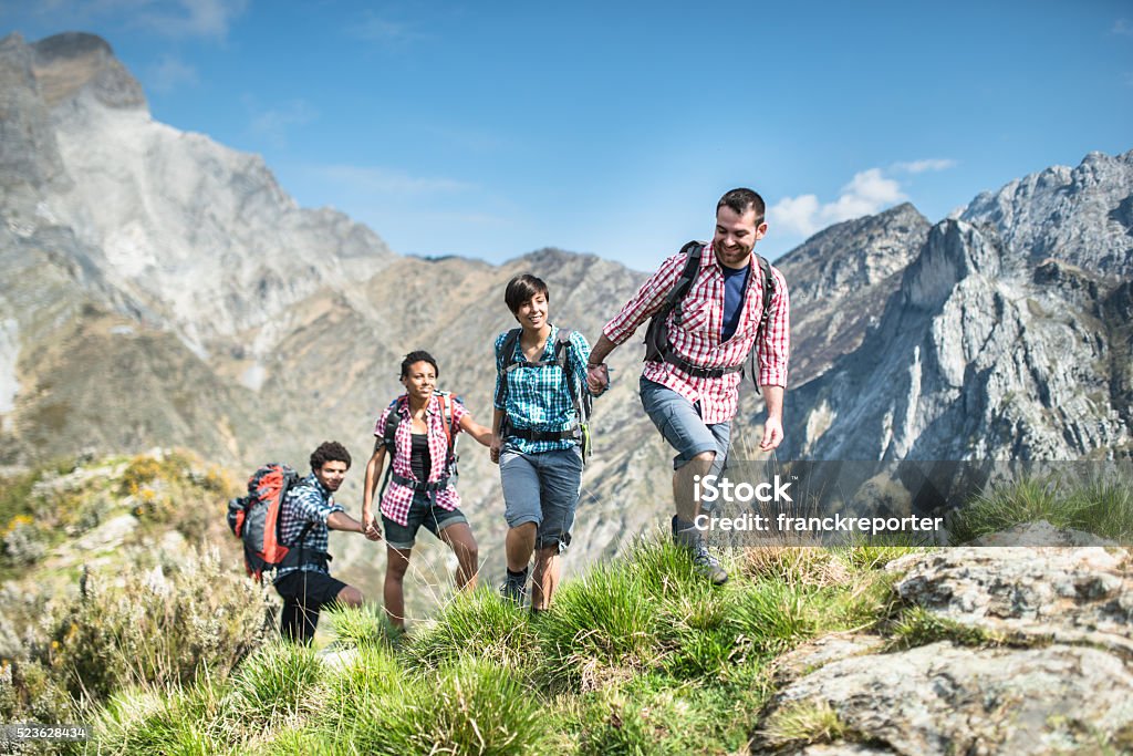 group of people hiking the mountain togetherness Hiking Stock Photo