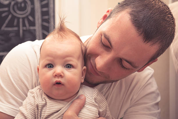 istock Father embracing his little baby 523628460