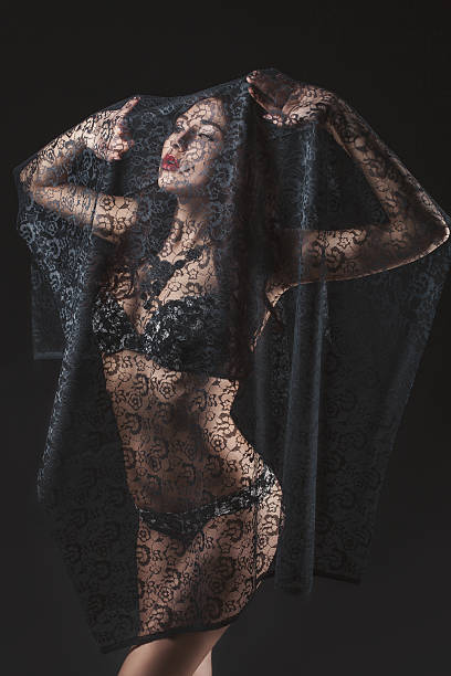 istock Woman under the black cloth. 523632215