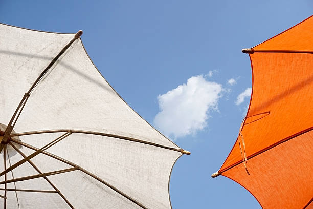 istock colorful sunshades umbrellas on a sunny summer day 523633351