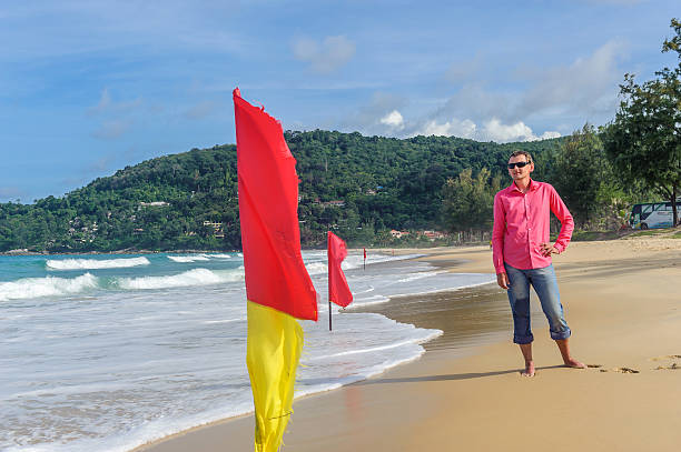istock Groom in a red shirt standing on a beach 523635363