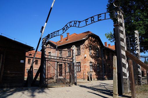 Oswiecim, Poland - August 25, 2013: Gates to Auschwitz Birkenau Concentration Camp, a former Nazi extermination camp on August 25, 2013 in Oswiecim, Poland