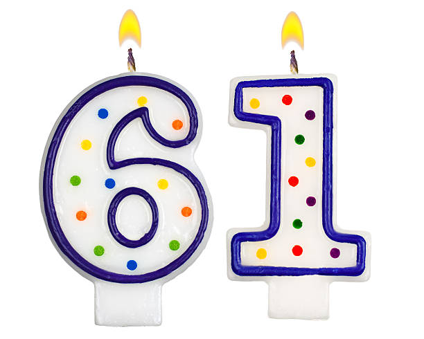 istock Birthday candles number sixty one isolated on white background 523645107