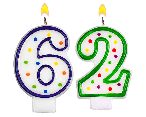istock Birthday candles number sixty two isolated on white background 523645111