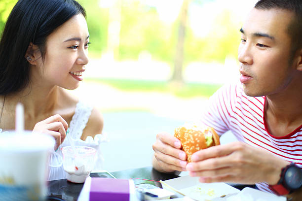 istock Young Chinese couple having lunch. 523647409