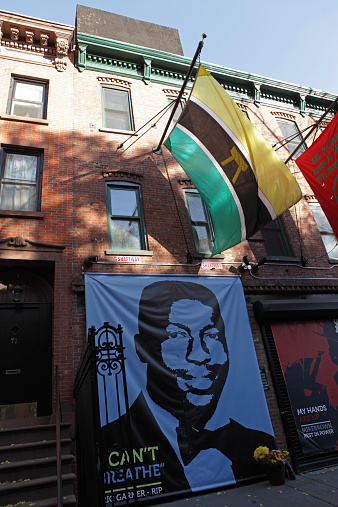 Brooklyn, New York, USA - November 15, 2014: Spike Lee's 40 Acres and a Mule filmworks studio on South Elliott Street in Brooklyn, New York. Posters of African American's killed by police in the United States are exhibited on the outside of the building. The memorial portraits include those of Eric Garner, Ezell Ford, John Crawford III, and