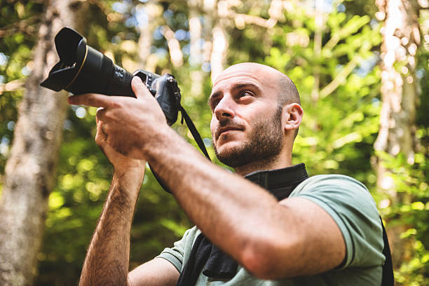 istock photographer on the woods 523652273
