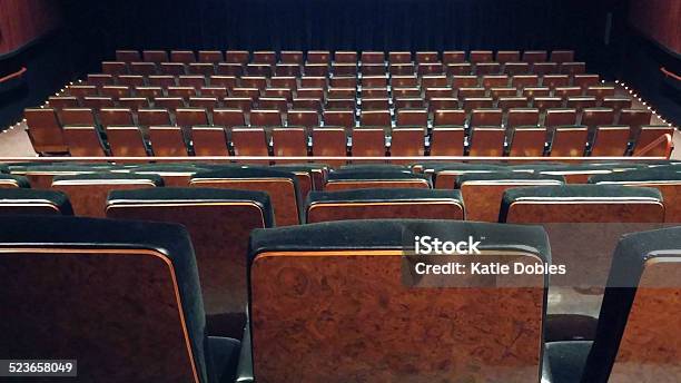 Empty Rows Of Wood Grain And Black Cushion Theatre Seats Stock Photo - Download Image Now