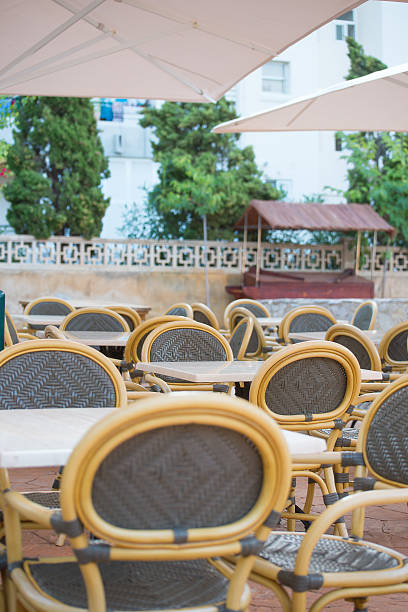 istock Empty outdoor street cafe. Chairs with tables. 523659307