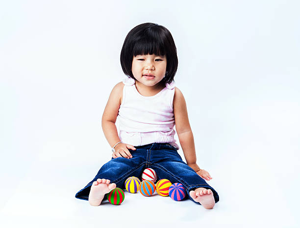 istock asian girl play colour ball 523660149