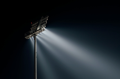 Stadium lights from behind, right wiev at night, horizontal