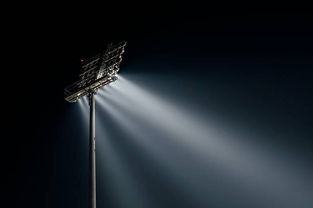 Stadium lights from behind, right wiev Stadium lights from behind, right wiev at night, horizontal floodlight stock pictures, royalty-free photos & images