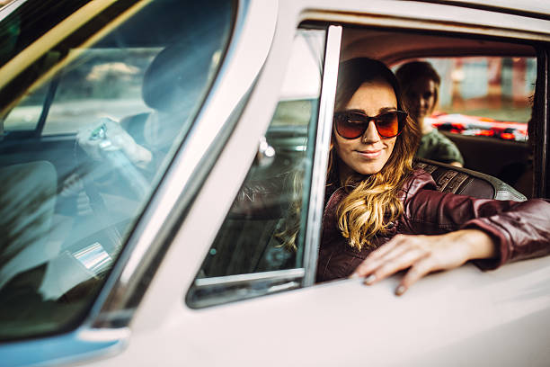 istock Happy Woman in Classic Car 523663219