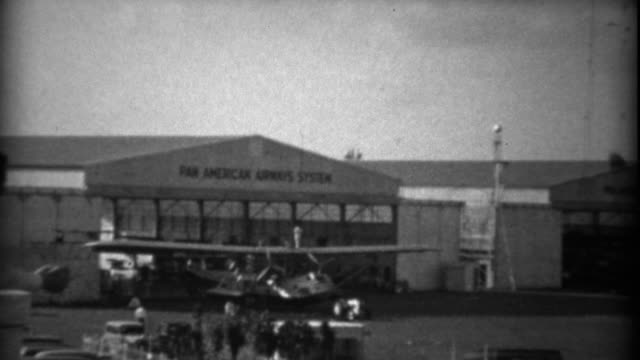 1935: Pan American Airways System airplane warehouse hangars.