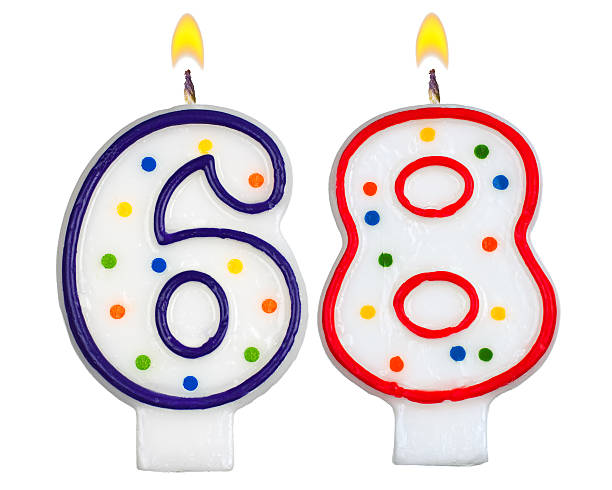 istock Birthday candles number sixty eight isolated on white background 523664029