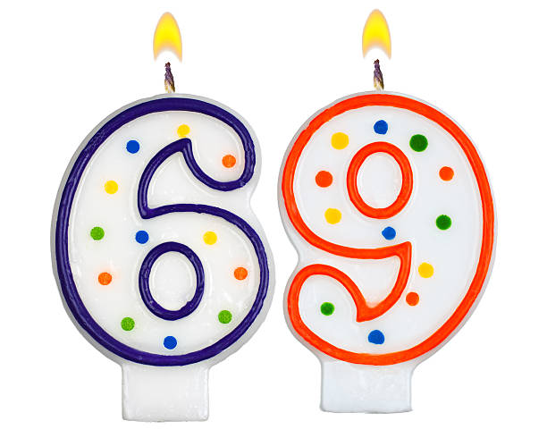 istock Birthday candles number sixty nine isolated on white background 523664031