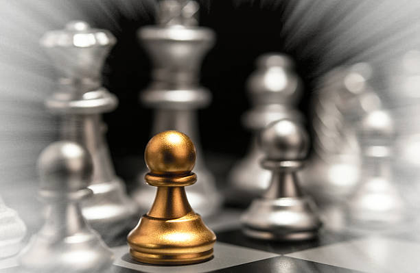 Stand out of a crowd  individuality concept Odd Chess Piece stock photo
