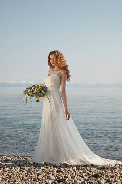 Young bride with flowers stock photo