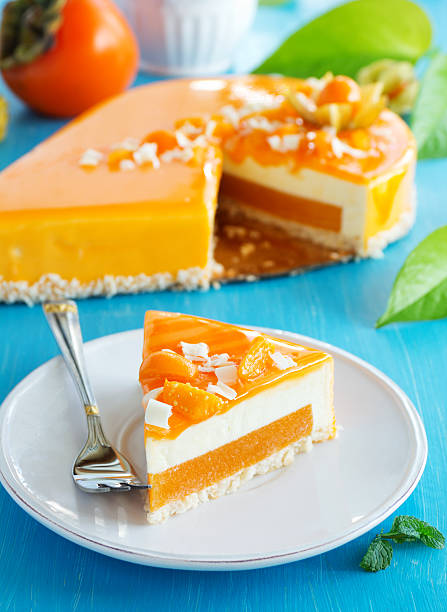 istock Creamy cake with coconut, mango and persimmon 523676215