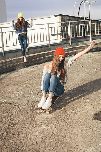 istock Two young  longboarding girl friends 523676403