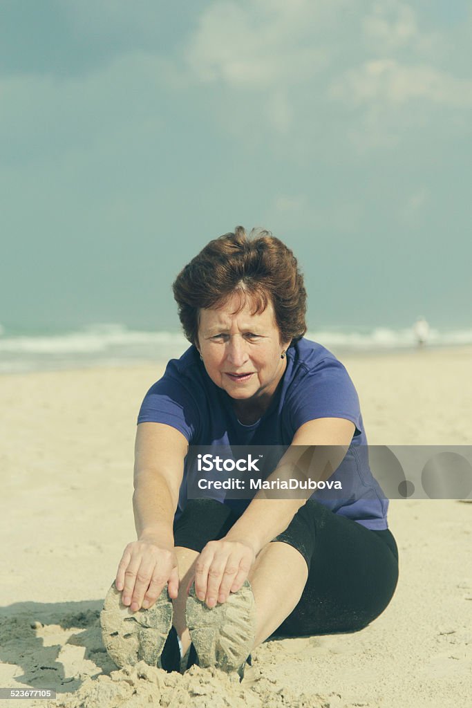 Senior Woman On vacation Senior Woman Running On Beautiful Beach Active Lifestyle Stock Photo