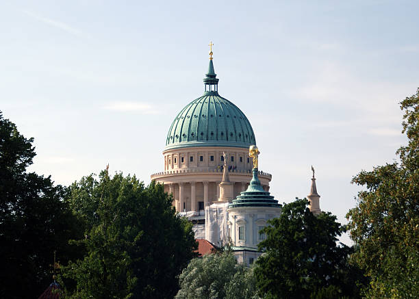 Potsdam, Germany - August 15, 2009: The outstanding dome of the St. Nicholas Church behind trees on August 15, 2009 in Potsdam.