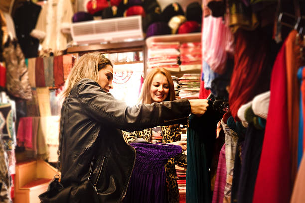 istock Two Friends Shopping Traditional Clothes 523678695