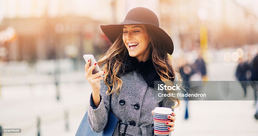 Texting Teen using a phone Beautiful Woman Stock Photo