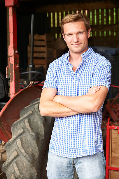 istock Portrait Of Farmer With Old Fashioned Tractor 523679679
