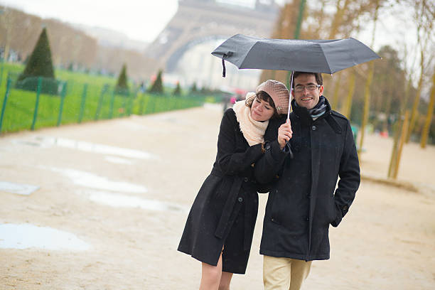 istock Couple in Paris under umbrella 523679725