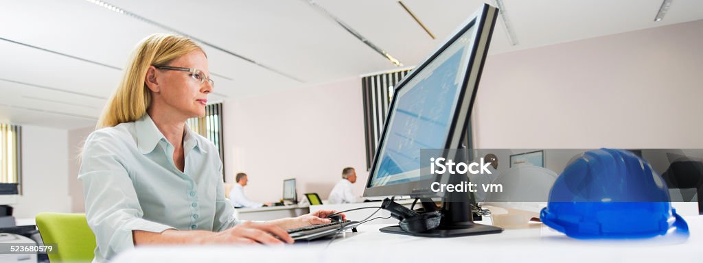 Female Engineer Working On Desktop Computer Stock Photo - Download ...