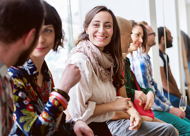 istock Group Of Young People During A Gallery Opening 523680601