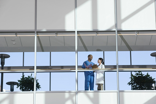 Two Doctors Talking in Corridor