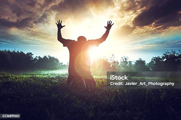 Prayer In The Morning In A Beautiful Sunrise Stock Photo - Download Image Now - Praying, Praising - Religion, Christianity