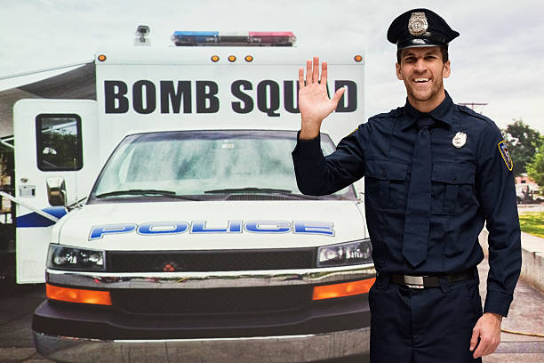 istock Smiling police outdoors and waving hand 523689926