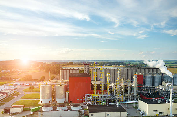 istock Sunset over biofuel factory 523691474