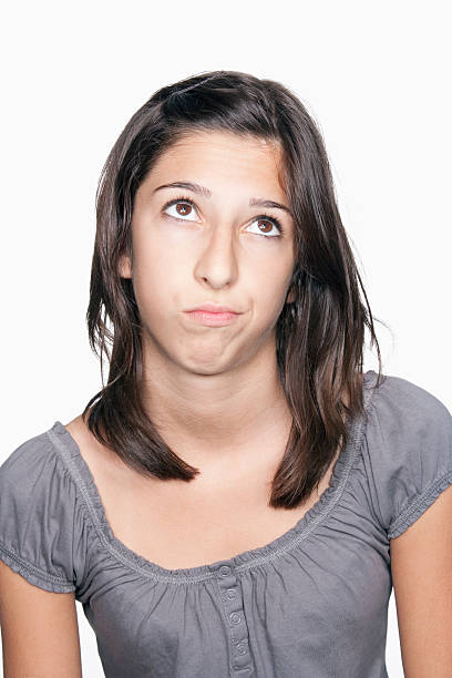 istock Girl looking up and thinking 523692375