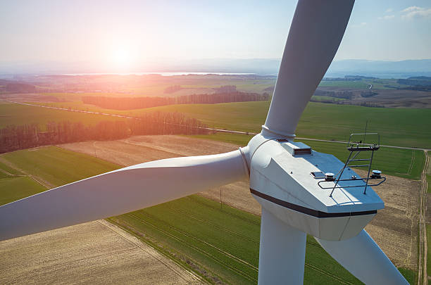 Sunset above the windmills Beautiful sunset above the windmills on the field landscape alternative energy scenics farm stock pictures, royalty-free photos & images