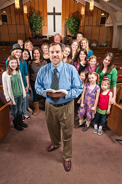 istock Pastor with His People Behind 523694447